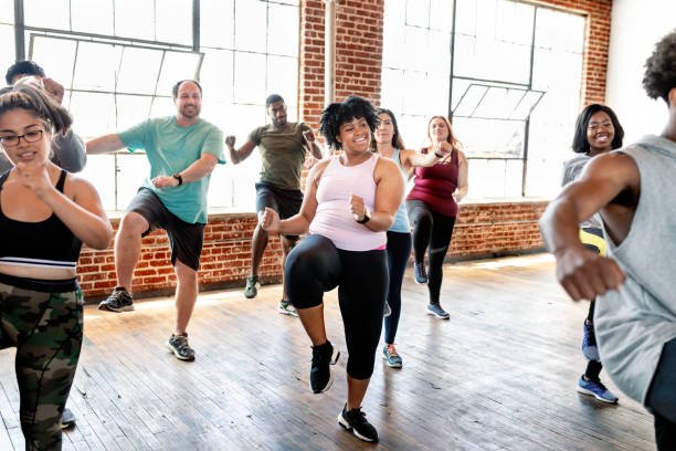diverse people in an active dance class